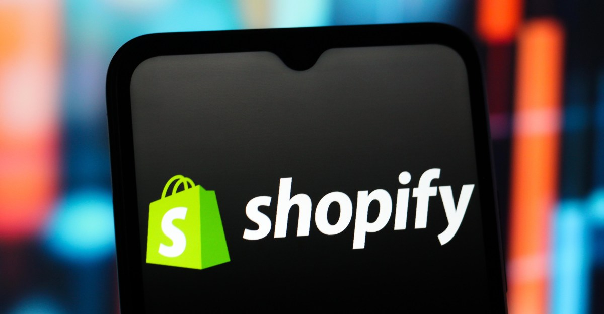 In this photo illustration, the Shopify logo is seen