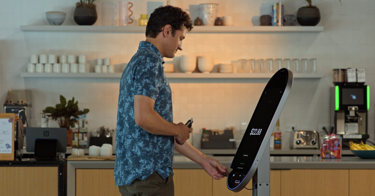 An image of someone using the Square Kiosk.